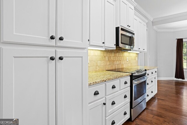 4227 Tillman Blf, Valdosta, GA 31602 - kitchen with appliances with stainless steel finishes, baseboards, ornamental molding, decorative backsplash, and white cabinets