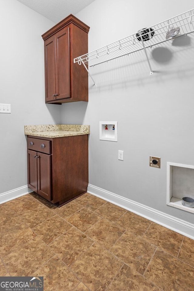 4227 Tillman Blf, Valdosta, GA 31602 - clothes washing area with hookup for an electric dryer, baseboards, washer hookup, and cabinet space