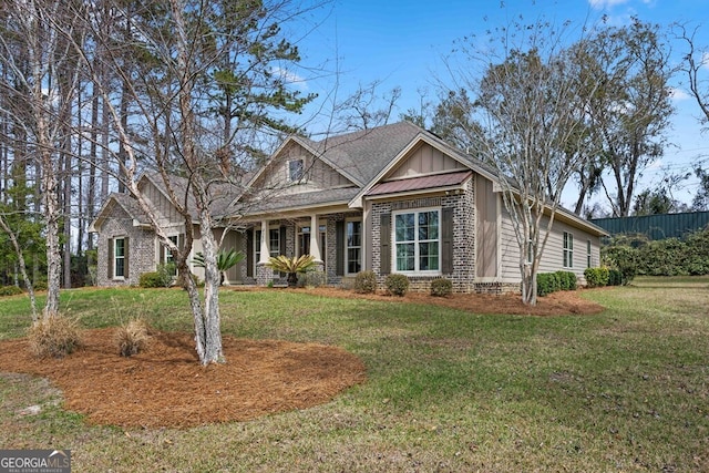 4227 Tillman Blf, Valdosta, GA 31602 - craftsman house featuring a front yard, board and batten siding, and brick siding