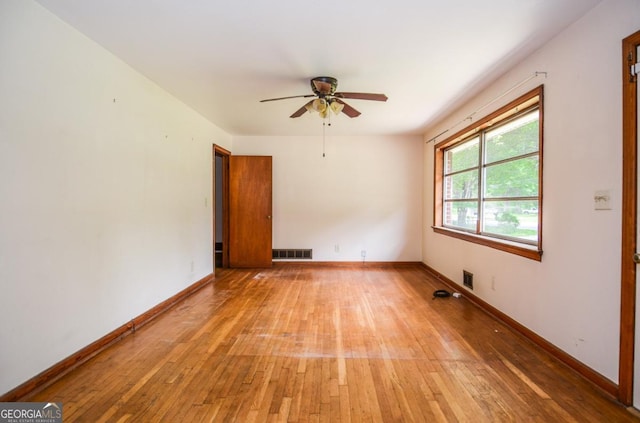 706 Jones Mill Rd, Cartersville, GA 30120 - spare room featuring a ceiling fan, light wood-style flooring, and baseboards