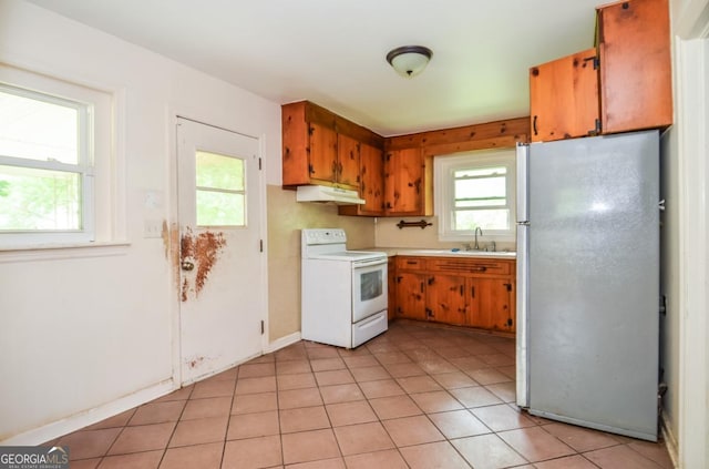 706 Jones Mill Rd, Cartersville, GA 30120 - kitchen featuring freestanding refrigerator, white electric range, under cabinet range hood, a sink, and light countertops