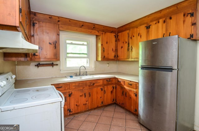706 Jones Mill Rd, Cartersville, GA 30120 - kitchen featuring freestanding refrigerator, white electric range oven, a sink, under cabinet range hood, and light countertops