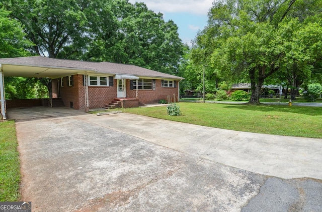 706 Jones Mill Rd, Cartersville, GA 30120 - ranch-style house featuring concrete driveway, a carport, a front lawn, and brick siding