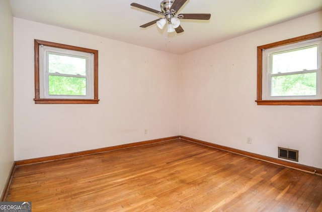 706 Jones Mill Rd, Cartersville, GA 30120 - spare room with healthy amount of natural light, light wood-type flooring, baseboards, and a ceiling fan
