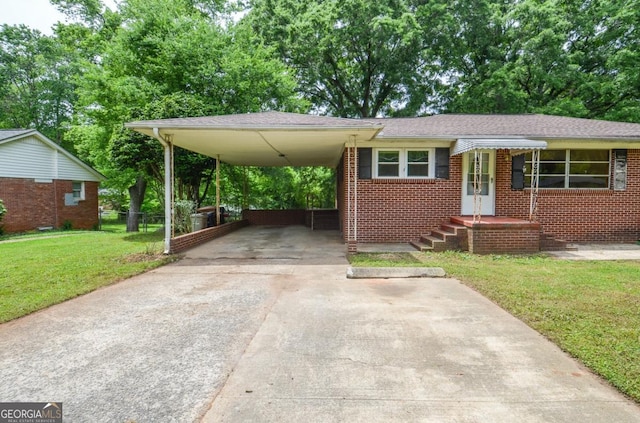 706 Jones Mill Rd, Cartersville, GA 30120 - view of front of property featuring concrete driveway, a carport, and brick siding
