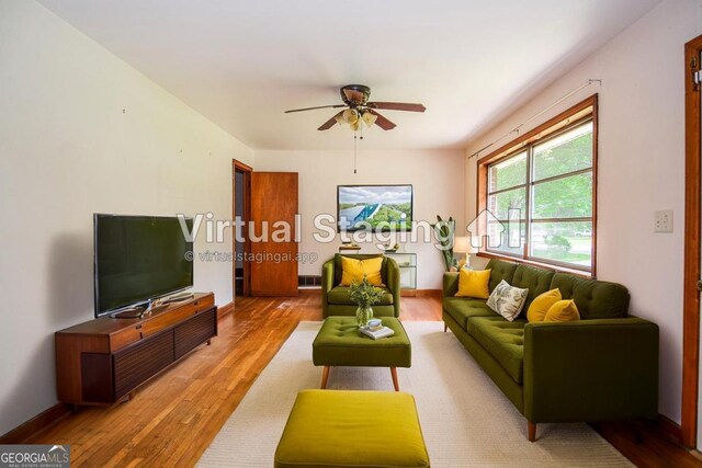 706 Jones Mill Rd, Cartersville, GA 30120 - living area with a ceiling fan, wood finished floors, and baseboards