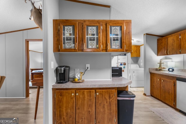 2021 Wyche Cir, Elberton, GA 30635 - kitchen featuring a textured ceiling, brown cabinetry, black microwave, crown molding, and dishwasher