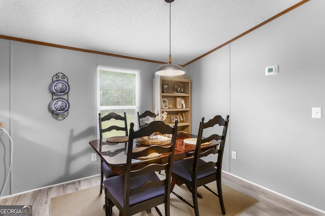 2021 Wyche Cir, Elberton, GA 30635 - dining area featuring crown molding, wood finished floors, and a textured ceiling