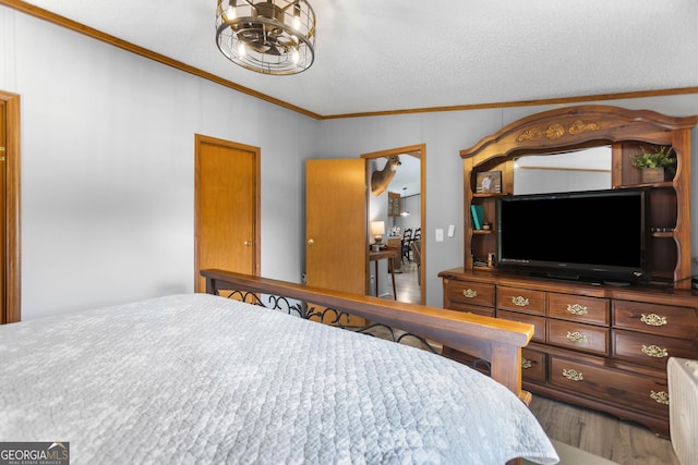 2021 Wyche Cir, Elberton, GA 30635 - bedroom with ornamental molding, wood finished floors, and a textured ceiling