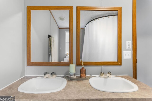 2021 Wyche Cir, Elberton, GA 30635 - full bathroom with double vanity and curtained shower