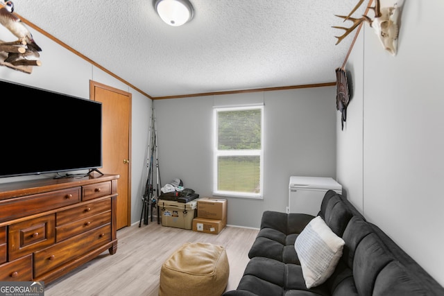 2021 Wyche Cir, Elberton, GA 30635 - living room with crown molding, a textured ceiling, and light wood-style floors