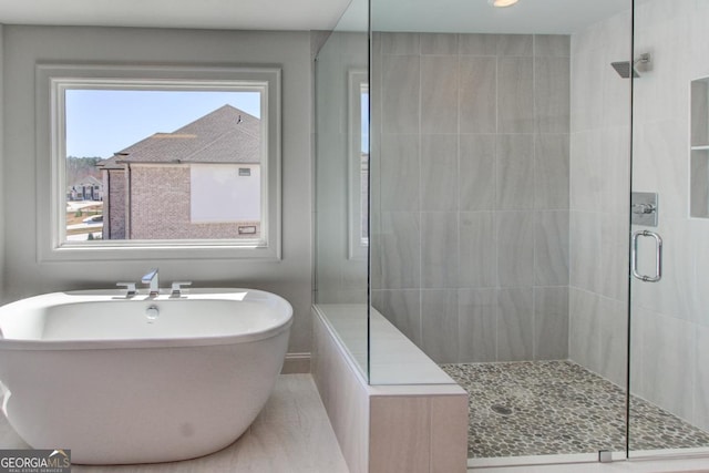3066 Reserve Ct SW, Conyers, GA 30094 - full bathroom with a shower stall and a freestanding bath