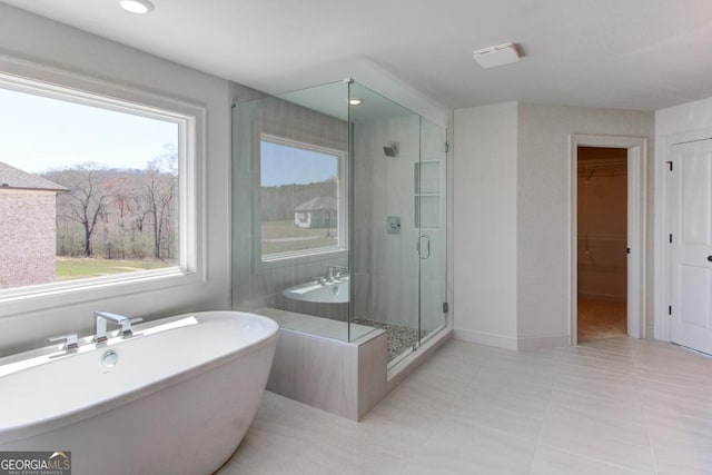 3066 Reserve Ct SW, Conyers, GA 30094 - bathroom featuring healthy amount of natural light, a stall shower, a freestanding bath, and recessed lighting