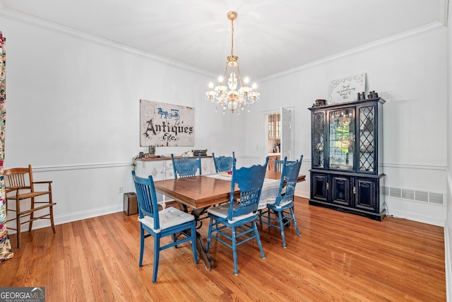 490 Water Wheel Ct, Cornelia, GA 30531 - dining area featuring a chandelier, wood finished floors, and crown molding