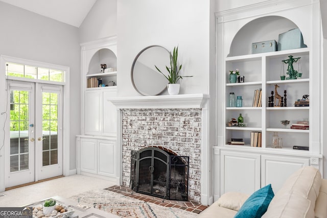 490 Water Wheel Ct, Cornelia, GA 30531 - living area with built in features, lofted ceiling, a brick fireplace, and french doors