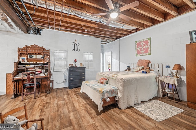490 Water Wheel Ct, Cornelia, GA 30531 - bedroom with wood finished floors, concrete block wall, and ceiling fan