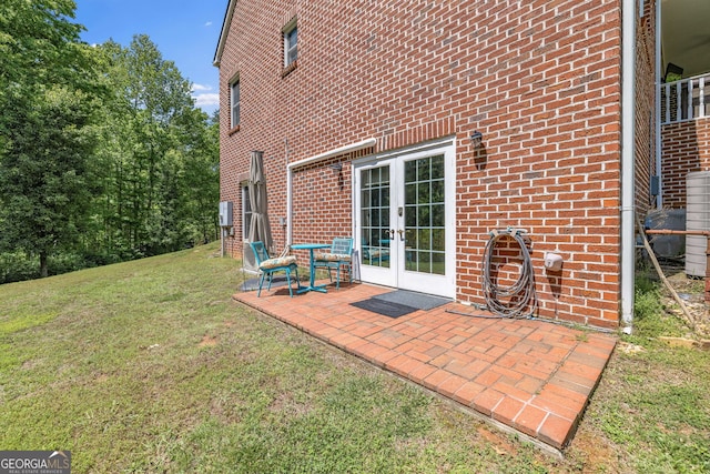 490 Water Wheel Ct, Cornelia, GA 30531 - back of property with french doors, brick siding, a lawn, and a patio