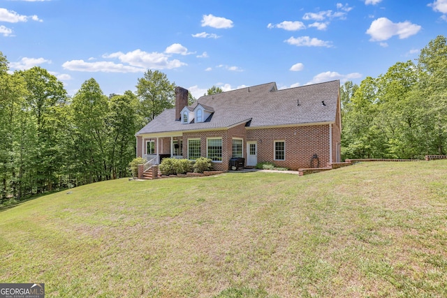 490 Water Wheel Ct, Cornelia, GA 30531 - rear view of house featuring brick siding, a chimney, and a lawn