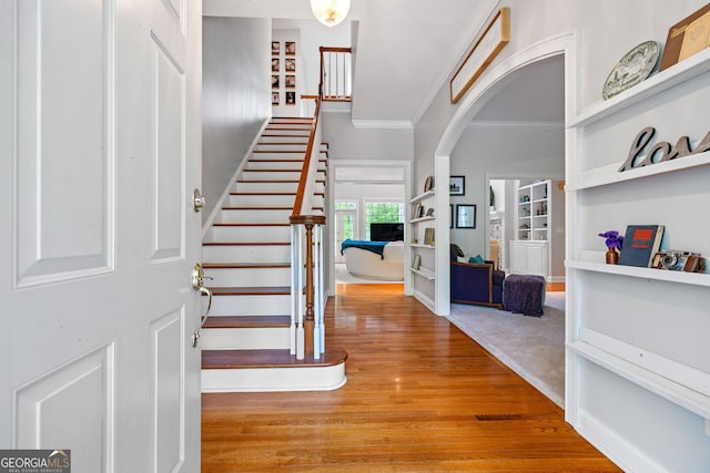 490 Water Wheel Ct, Cornelia, GA 30531 - foyer with arched walkways, ornamental molding, stairway, and wood finished floors