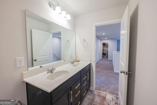 3172 Lowell Rd, Bethlehem, GA 30620 - full bath featuring double vanity, baseboards, and washer / clothes dryer