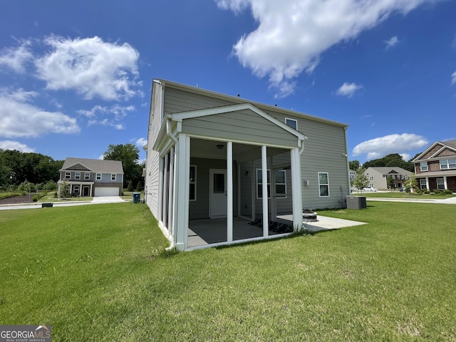 3172 Lowell Rd, Bethlehem, GA 30620 - rear view of property with cooling unit, a patio area, a sunroom, and a yard