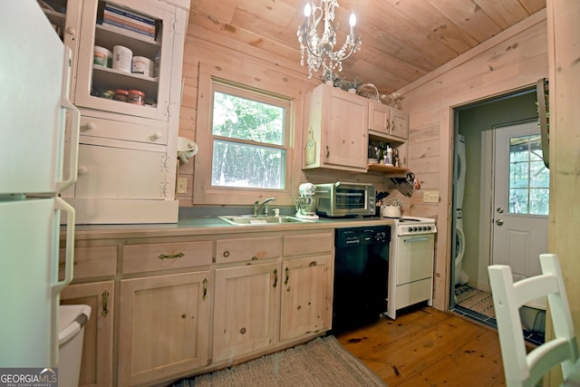 785 Bernhardt Rd, Ellijay, GA 30536 - kitchen with white appliances, stacked washing machine and dryer, a sink, wooden walls, and light wood-style floors
