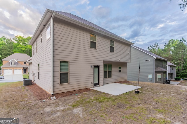 back of property with a patio and central AC unit