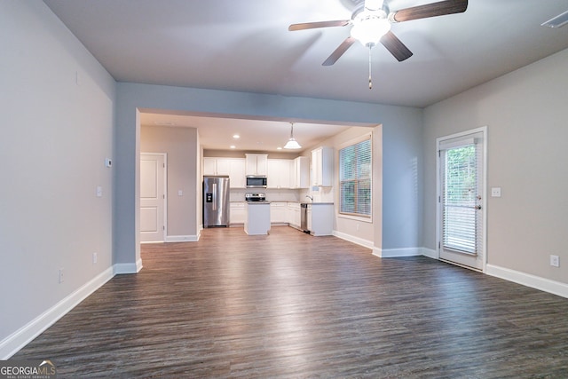 unfurnished living room featuring dark wood-style flooring, baseboards, a ceiling fan, and recessed lighting