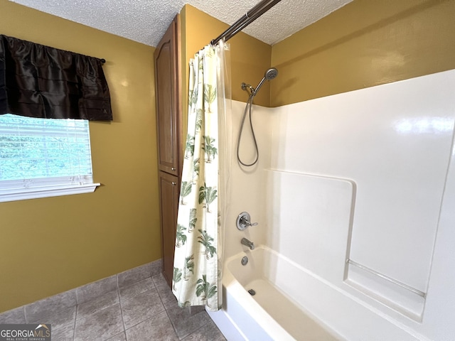full bath featuring a textured ceiling, tile patterned flooring, and shower / bathtub combination with curtain