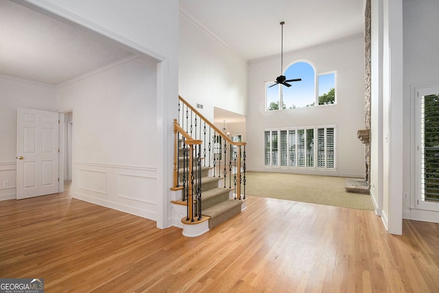 315 Hembree Grove Trce, Roswell, GA 30076 - foyer entrance with crown molding, healthy amount of natural light, wood finished floors, stairway, and a high ceiling