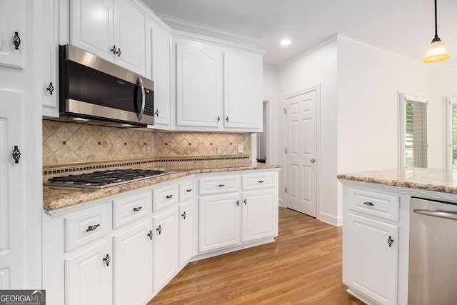 315 Hembree Grove Trce, Roswell, GA 30076 - kitchen with appliances with stainless steel finishes, recessed lighting, light wood-type flooring, decorative backsplash, and white cabinetry
