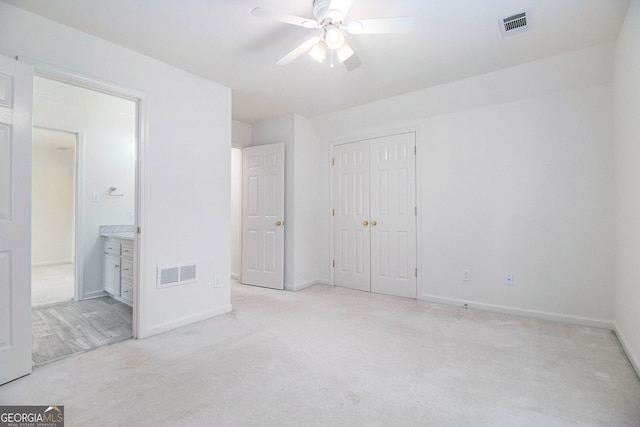 315 Hembree Grove Trce, Roswell, GA 30076 - unfurnished bedroom featuring light colored carpet, baseboards, a closet, ensuite bathroom, and a ceiling fan