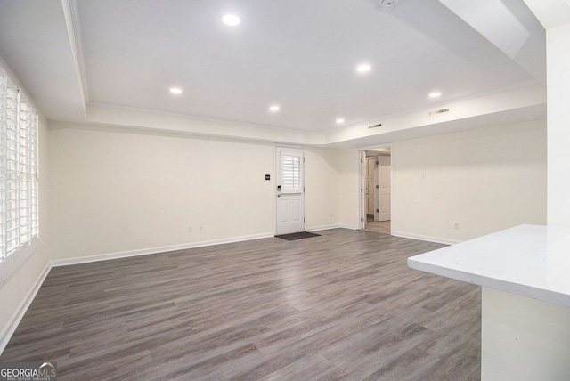 315 Hembree Grove Trce, Roswell, GA 30076 - unfurnished living room featuring a tray ceiling, baseboards, recessed lighting, and wood finished floors