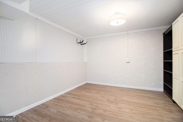 315 Hembree Grove Trce, Roswell, GA 30076 - unfurnished room with light wood finished floors, baseboards, brick wall, and ornamental molding