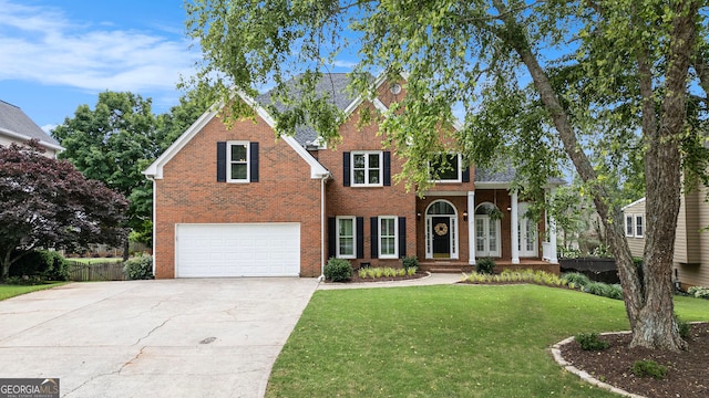 315 Hembree Grove Trce, Roswell, GA 30076 - traditional-style house featuring a garage, concrete driveway, a front yard, and brick siding