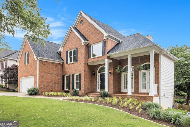 315 Hembree Grove Trce, Roswell, GA 30076 - traditional-style house featuring a chimney, a garage, a front yard, brick siding, and a shingled roof