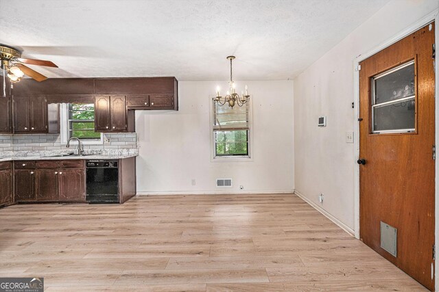 2954 Ann Marie Ln, Rex, GA 30273 - kitchen with black dishwasher, ceiling fan, dark brown cabinets, light wood finished floors, and light countertops