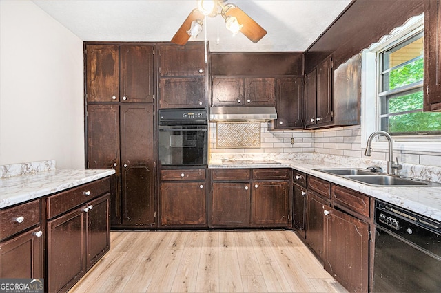 2954 Ann Marie Ln, Rex, GA 30273 - kitchen with black appliances, under cabinet range hood, light wood-style floors, a ceiling fan, and dark brown cabinets