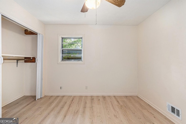 2954 Ann Marie Ln, Rex, GA 30273 - unfurnished bedroom with light wood-style flooring, a closet, and ceiling fan