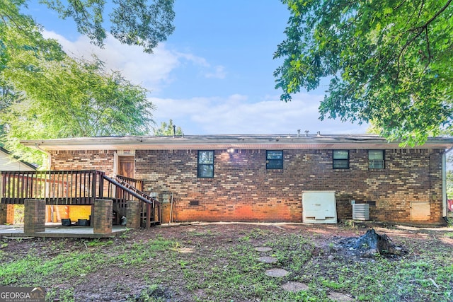2954 Ann Marie Ln, Rex, GA 30273 - rear view of house with brick siding and a wooden deck