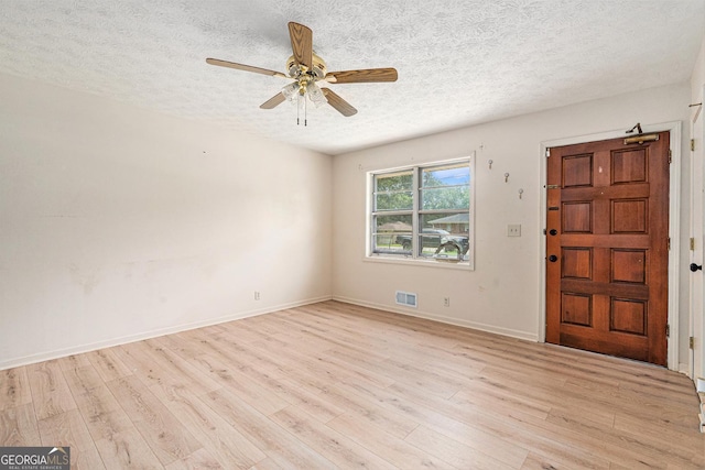 2954 Ann Marie Ln, Rex, GA 30273 - entrance foyer with a textured ceiling, light wood-type flooring, and ceiling fan