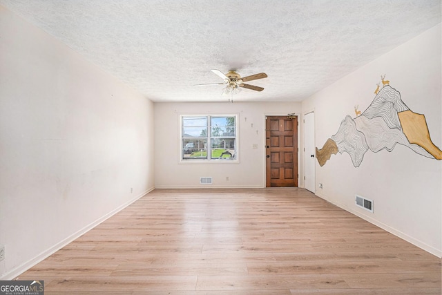 2954 Ann Marie Ln, Rex, GA 30273 - spare room with light wood-style floors, a ceiling fan, and a textured ceiling