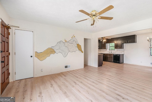 2954 Ann Marie Ln, Rex, GA 30273 - unfurnished living room featuring ceiling fan and light wood-style flooring