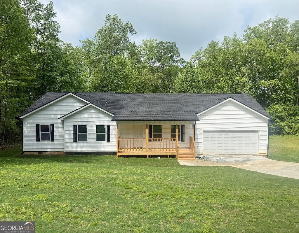 view of front of property featuring a porch, an attached garage, a front lawn, and driveway