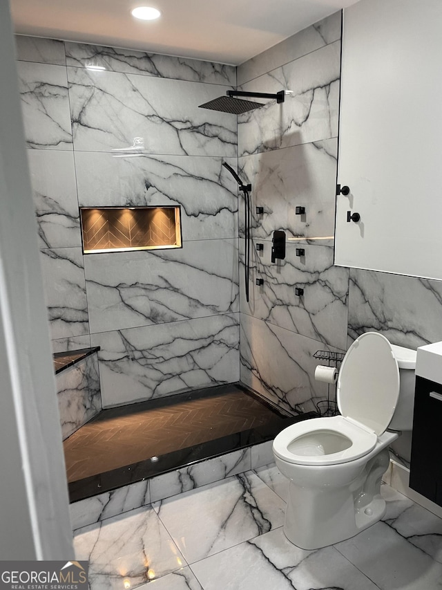 bathroom featuring a marble finish shower, toilet, marble finish flooring, recessed lighting, and vanity