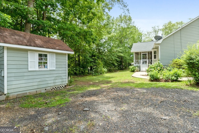 view of yard featuring a sunroom