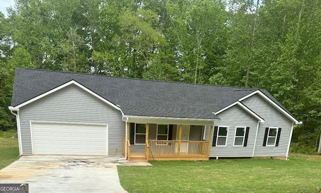 view of front of property featuring a porch, driveway, an attached garage, and a shingled roof