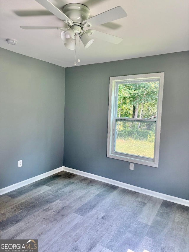 191 Deerfield Ln, Carrollton, GA 30116 - empty room with ceiling fan, wood finished floors, and a smoke detector