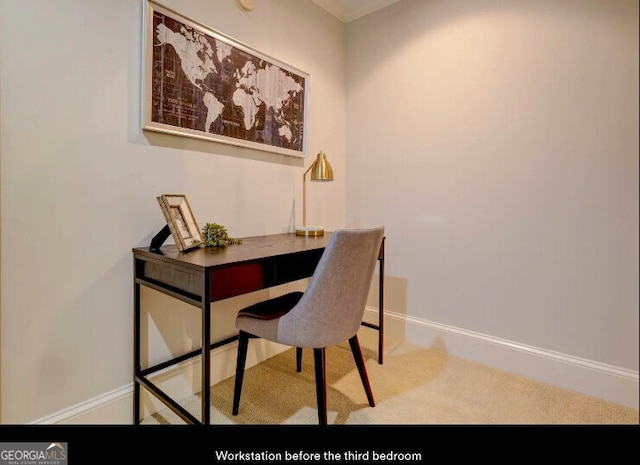carpeted home office featuring baseboards