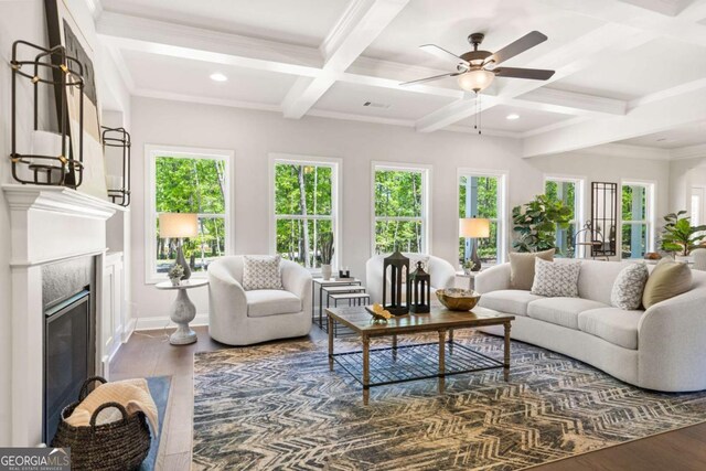 2749 Porches Ln, Dacula, GA 30019 - living area featuring coffered ceiling, healthy amount of natural light, dark wood finished floors, a ceiling fan, and beam ceiling